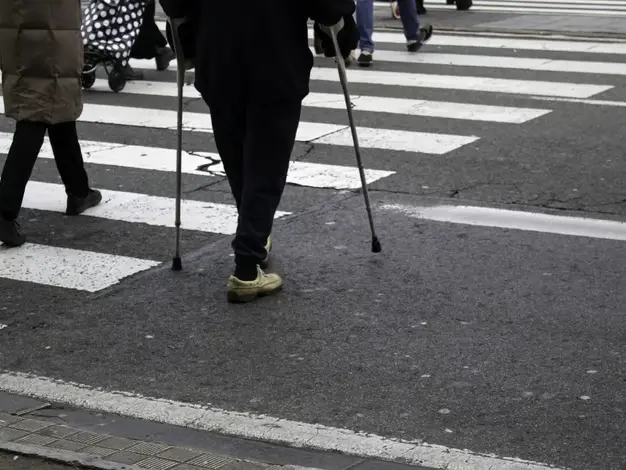 Attorney examining roadway layout and crosswalk markings after fatal pedestrian crash in Arrowhead Ranch Glendale